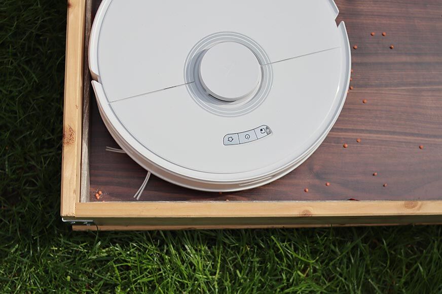 Roborock Q7 Max cleans in a corner.